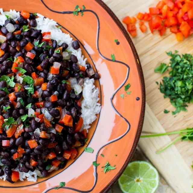Rice and black beans with vegetables and herbs