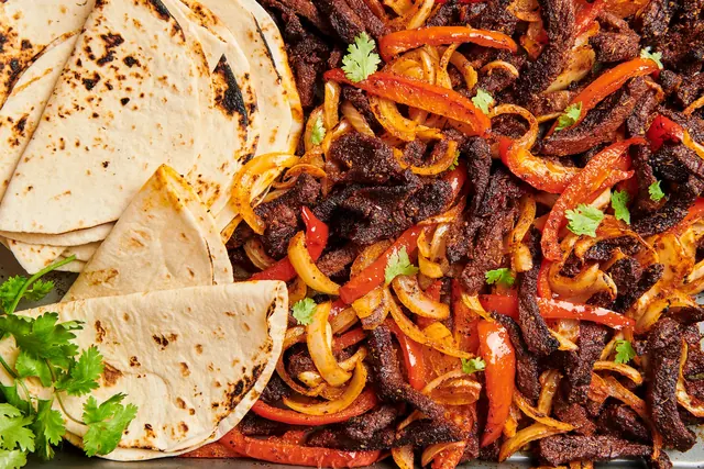 A generous skillet of steak fajitas